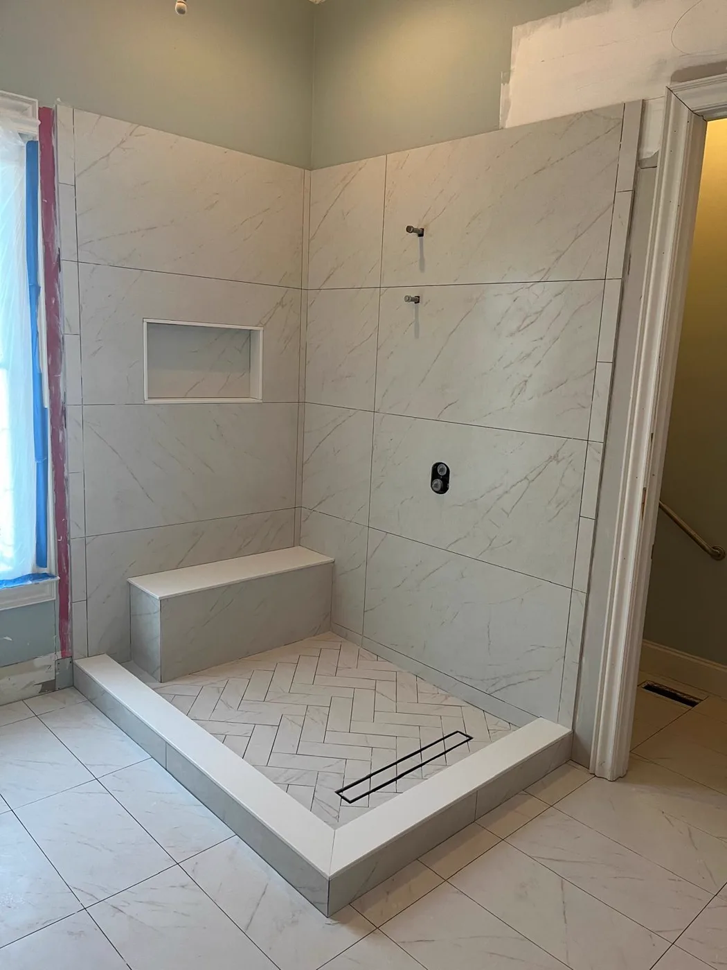 Finished walk-in shower with a built-in bench and a tiled niche, master bathroom remodel, Metro Atlanta