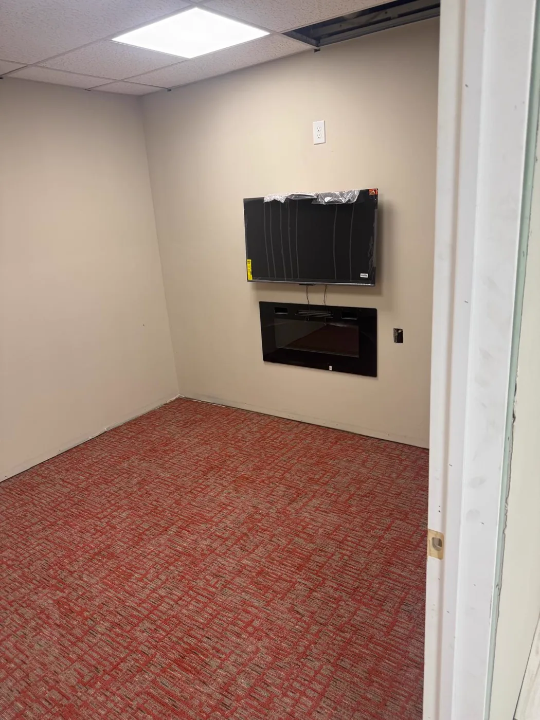 Finished office with a fireplace insert and a TV wall, commercial venue renovation, Metro Atlanta