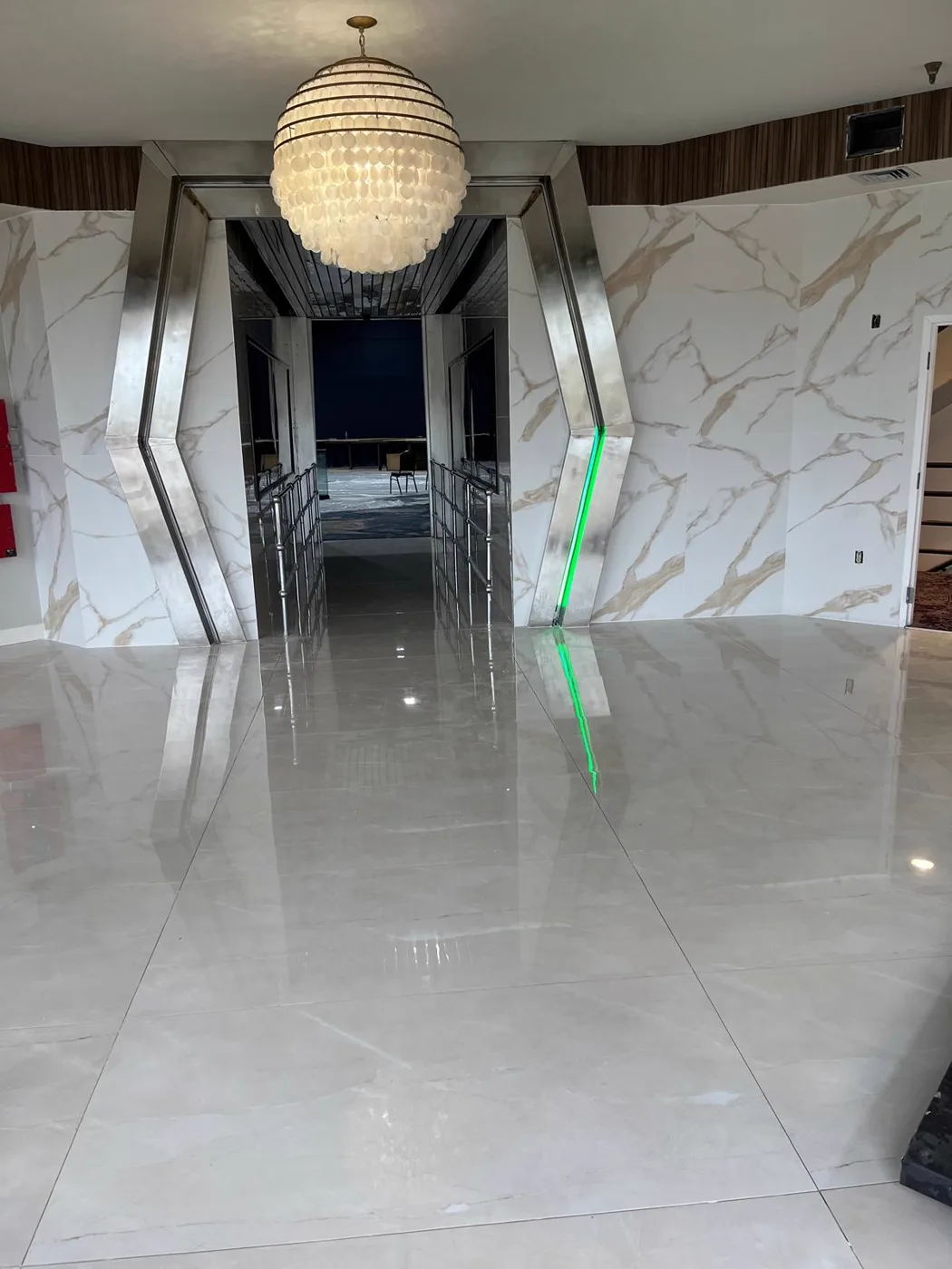 Finished lobby with a chandelier and polished marble floor, commercial venue renovation, Metro Atlanta