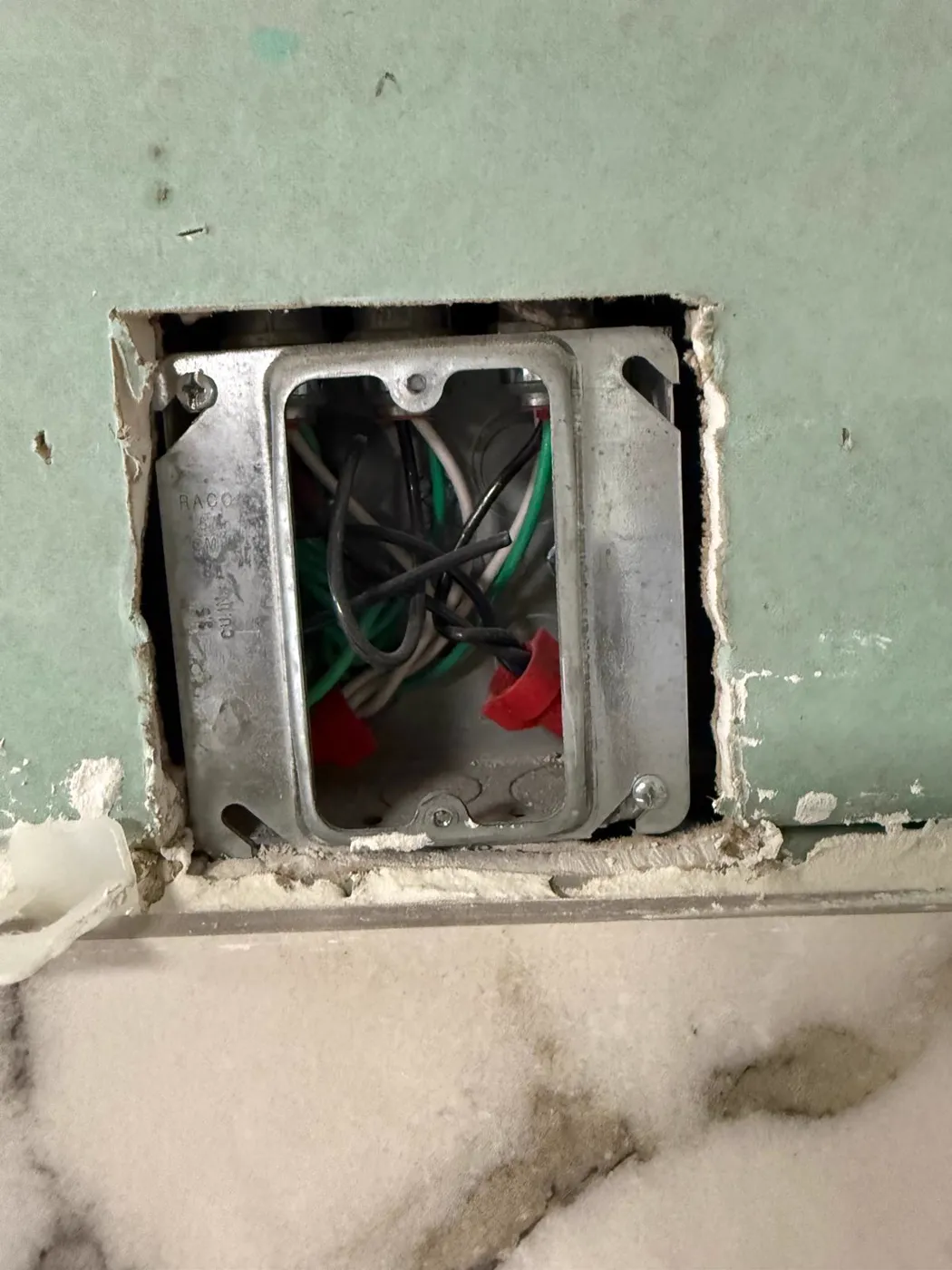 Junction box wiring inside a wall opening during an electrical rough-in, Metro Atlanta