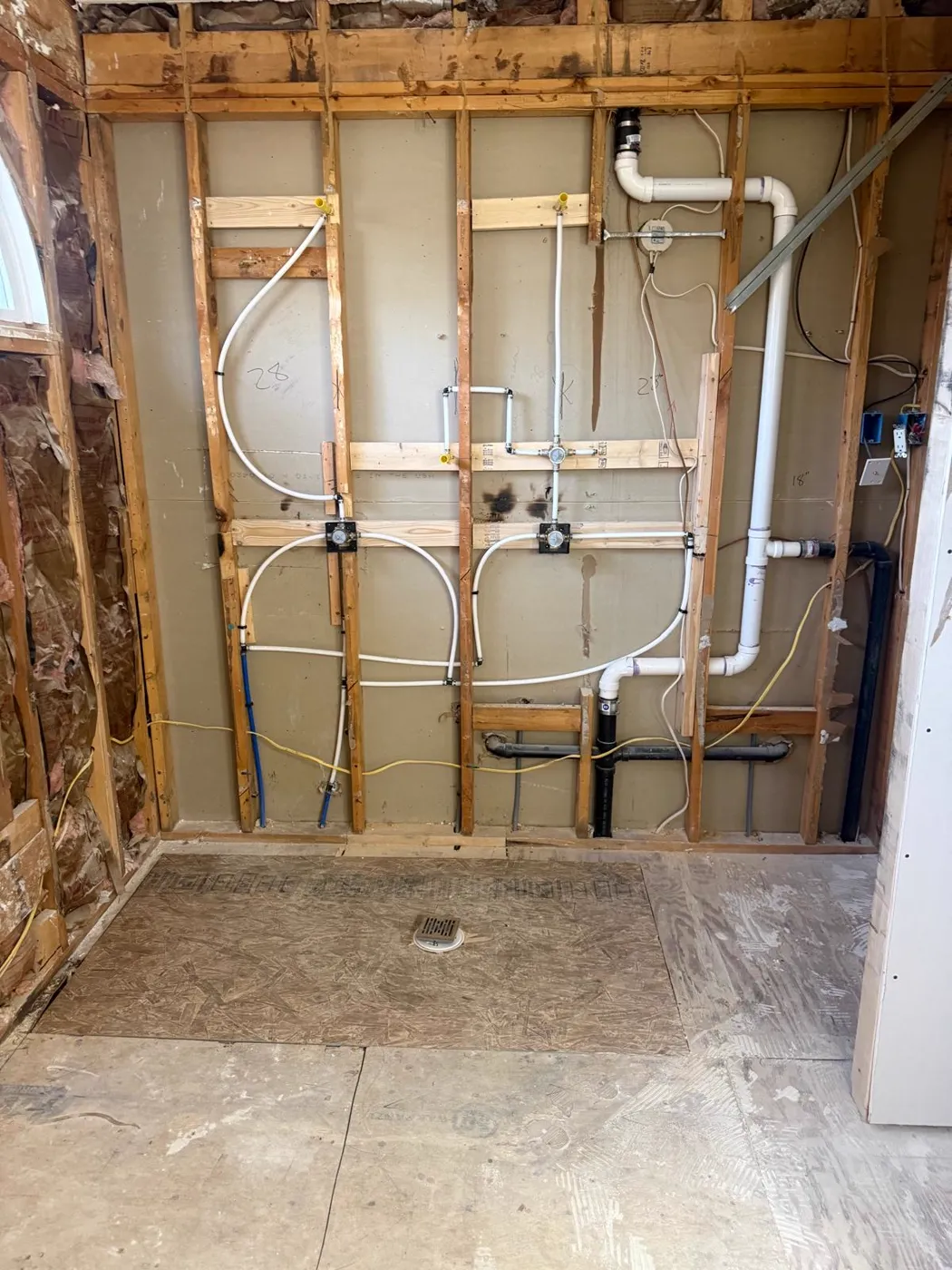 Plumbing rough-in across an open framed wall before drywall, Metro Atlanta